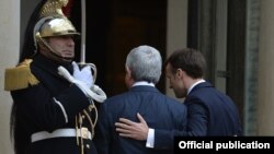 France - French President Emmanuel Macron (R) welcomes his Armenian counterpart Serzh Sarkisian before a meeting at the Elysee Palace in Paris, January 23, 2018