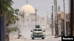 An SDF military vehicle in western Raqqa Province earlier this month.