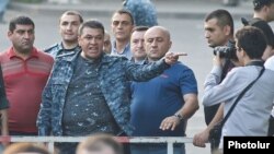 Armenia - Vladimir Gasparian, the chief of the Armenian police, rages at protesters and reporters gathered on Marshal Bagramian Avenue, Yerevan, 28Jan2015.