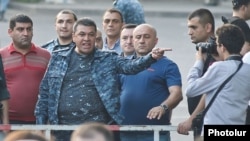 Armenia - Vladimir Gasparian, the chief of the Armenian police, rages at protesters and reporters gathered on Marshal Bagramian Avenue, Yerevan, 28Jan2015.