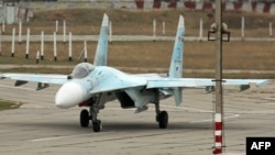 A Russian Su-27 SM fighter jet lands on the airfield of Belbek military airport outside Sevastopol, Crimea, November 26, 2014