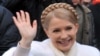 Ukraine's prime minister and presidential candidate Yulia Tymoshenko smiles as she greets people after casting her vote in her hometown of Dnipropetrovsk.