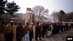 Former Taliban militants attend a ceremony during which they surrender arms under a US-backed Afghan government amnesty program, in Baghlan, January 7, 2014.