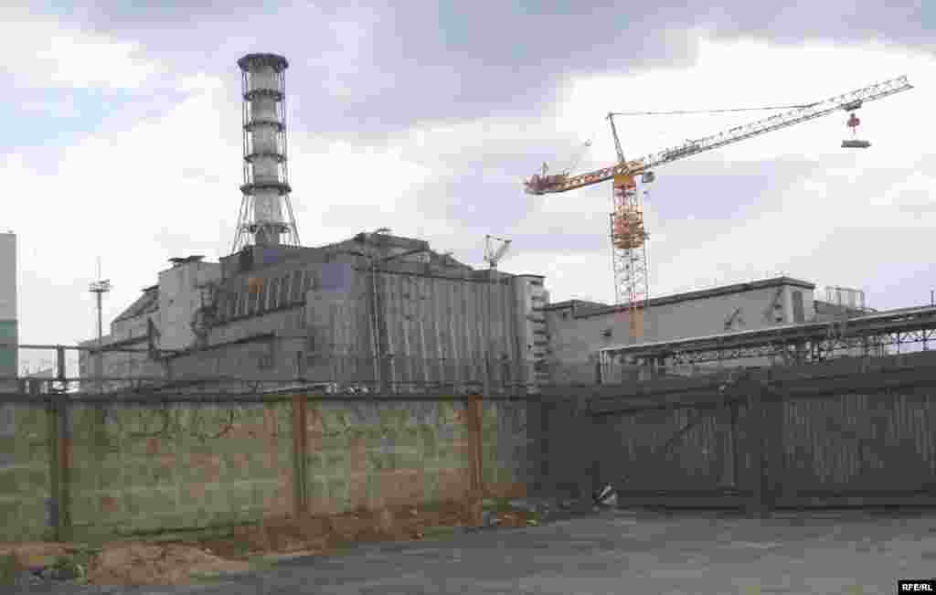 The sarcophagus meant to contain the radiation at Chornobyl was built hastily, and deteriorated quickly. Work continues on a new steel dome designed to last 100 years, labeled the New Safe Confinement.