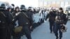Қызмет қаруы мен арнайы құралдары бар полиция жасағы Ақтау қаласының орталық алаңында тұр. 18 желтоқсан 2011 жыл.