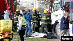 Israeli rescue forces work at the scene of a truck-ramming incident in Jerusalem on January 8.