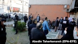 Iranians wait outside a lab to have Covid-19 coronavirus test in Tehran, March 9, 2020