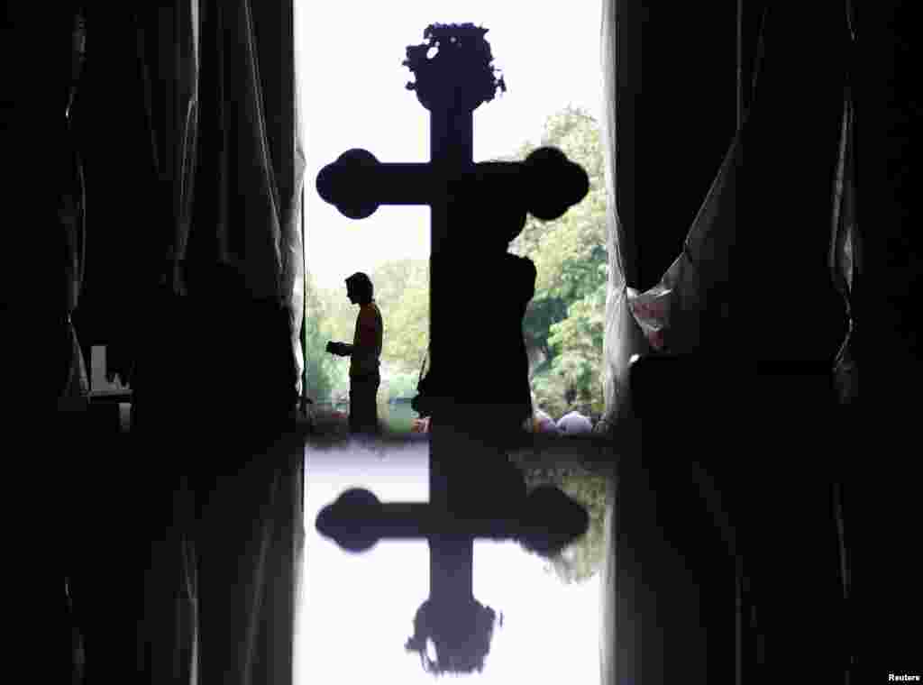 A worshipper prays during Good Friday at the St. Sava temple in Belgrade, as Serbia and other Eastern Orthodox countries celebrate Easter. (Reuters/Marko Djurica)