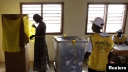 A South Sudanese woman votes at a polling station during the referendum in Juba on January 9.