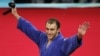 Irakli Tsirekidze accepted his gold with a message in hand