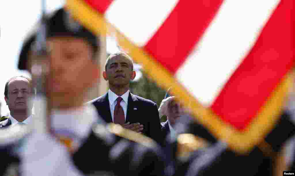 U.S. President Barack Obama and French President Francois Hollande participate in the 70th French-American Commemoration D-Day Ceremony at the Normandy American Cemetery in Colleville-sur-Mer.