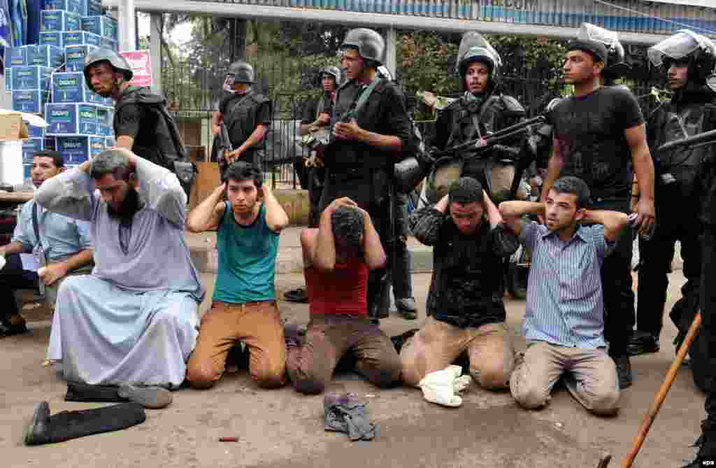 Security forces detain supporters of ousted President Muhammad Morsi, who have been staging sit-in protests to demand his reinstatement. 