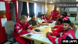 An image grab taken from a broadcast by Iranian broadcaster IRIB) on July 22, shows crew members of the British-flagged Stena Impero tanker after it was seized by Iran's Revolutionary Guard Corps.