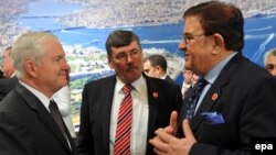 U.S. Defense Secretary Robert Gates (left), British Defense Secretary Bob Ainsworth (center), and Afghanistan's Defense Minister Abdul Rahim Wardak chat before the NATO meeting in Istanbul.