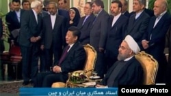 Chinese president Xi Jinping (foreground left) and Iranian President Hassan Rohani (foreground right) in Tehran on January 23.