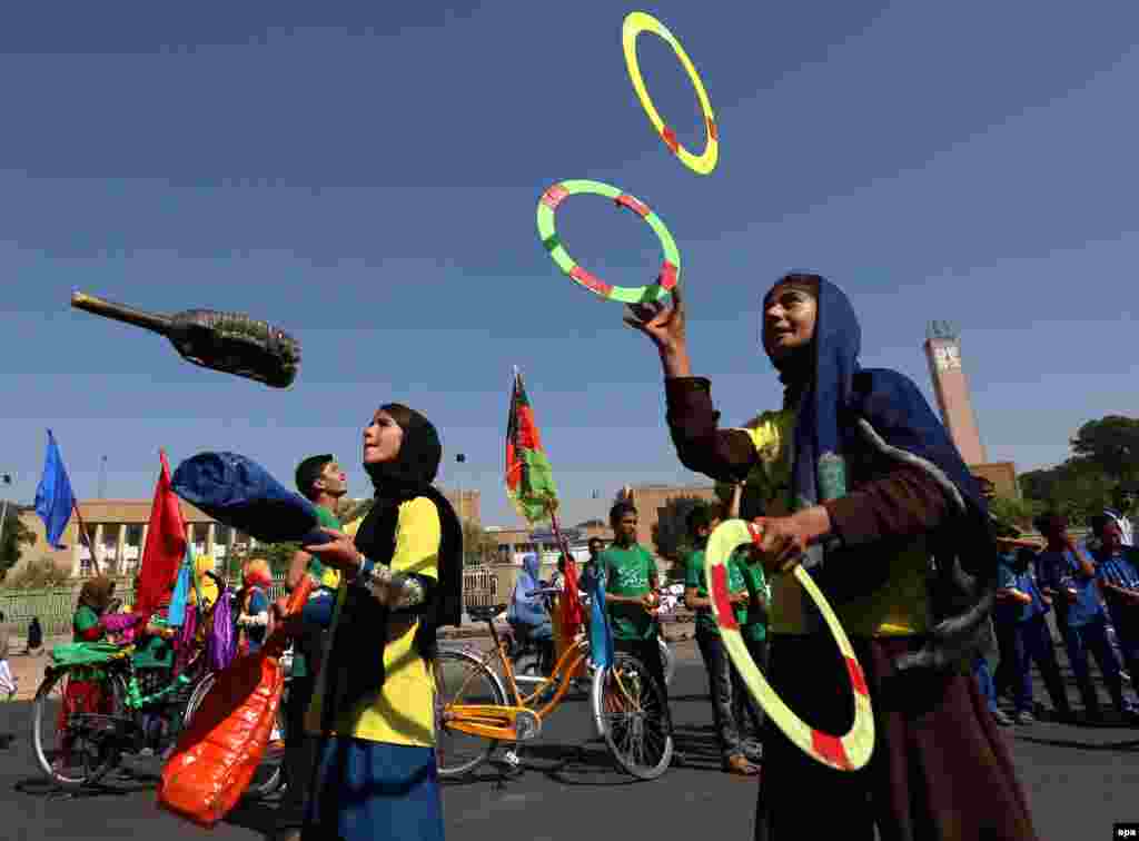 Afghan children juggle as they mark World Peace Day in Herat on September 22. (epa/Jalil Rezayee)