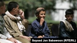 Pardoned would-be child suicide bombers pray during a ceremony attended by Afghan President Hamid Karzai to mark the release of some 20 youths at the Presidential Palace in Kabul.