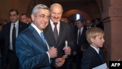 Armenia -- President Serzh Sarkisian (L), his Belarus counterpart Aleksandr Lukashenko and his son Nikolay attend the opening ceremony for a newly built Armenian church, 14May2013