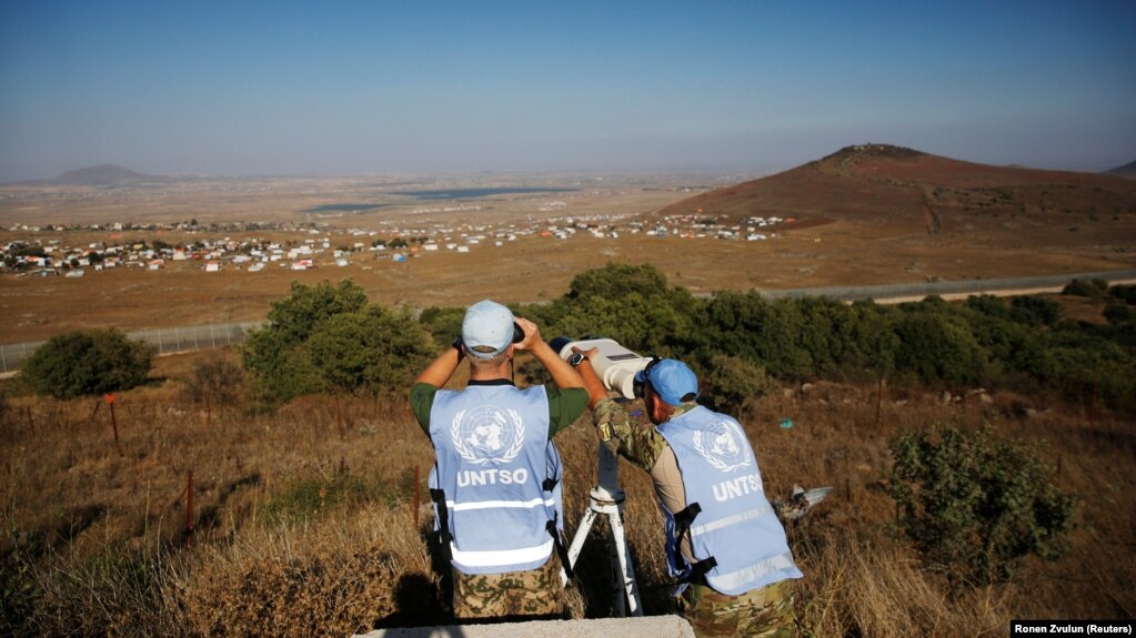 UN peacekeeping troops look over the border line between Syria and the Israeli-occupied Golan Heights.