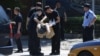 Полицейские на месте врыва у посольства США в Пекине, 26 июля 2018 года
