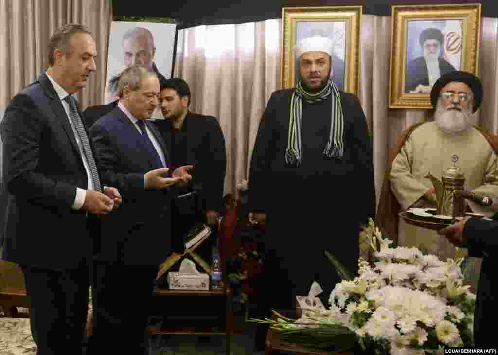 Syrian Deputy Foreign Minister Faisal Miqdad (second left) attended a memorial service for Soleimani in the Syrian capital, Damascus. Iran's Quds Force had shored up support for Syrian President Bashir al-Assad when he looked close to defeat.