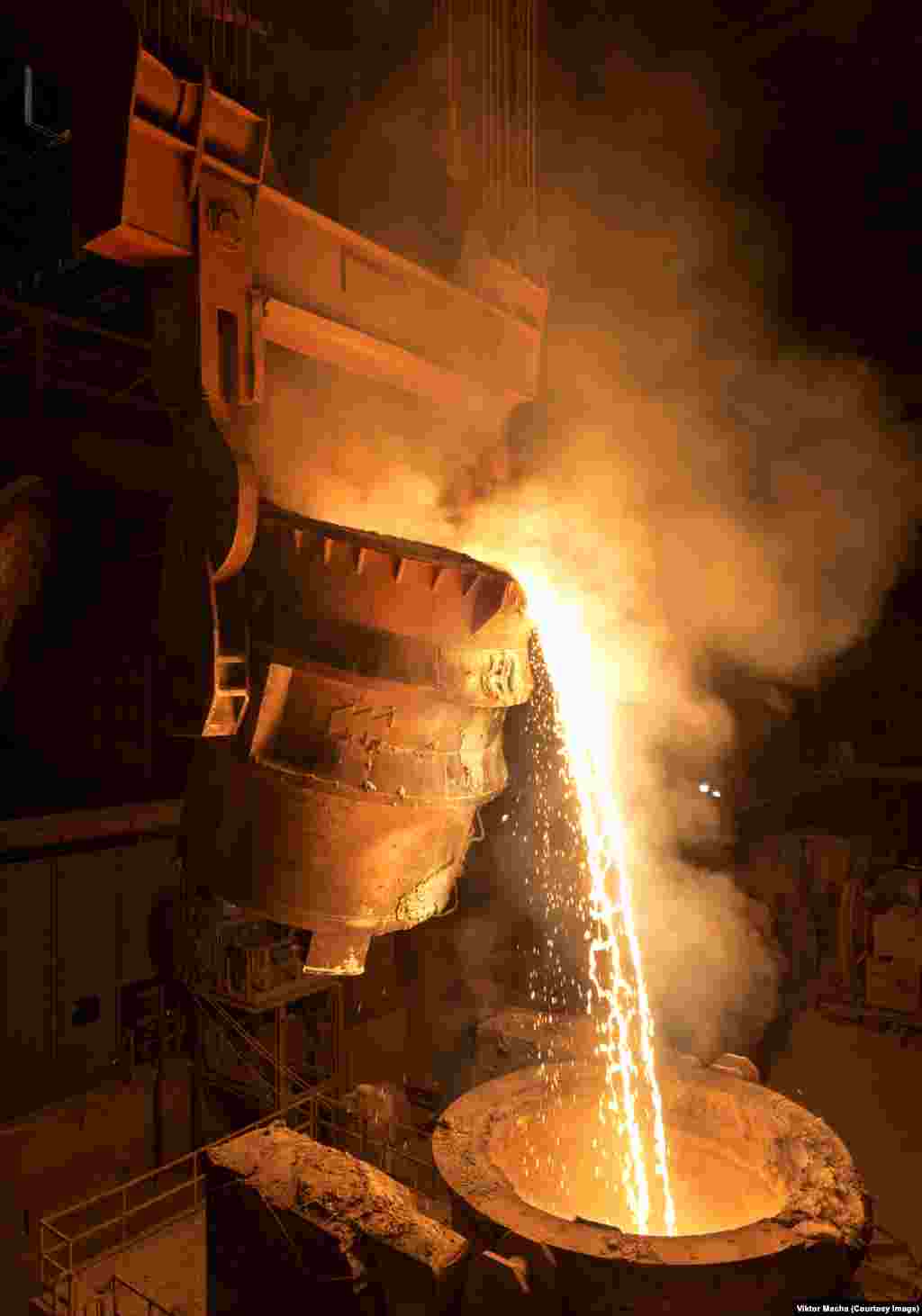 Pouring slag in Chatelet, Belgium.&nbsp;Macha says his love of heavy industry was passed down through generations of iron and steelworkers on both sides of his family.