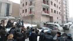 Armenia -- Police officers cordon off an apartment building in Yerevan where former National Security Service Director Georgi Kutoyan was found dead, January 17, 2020.