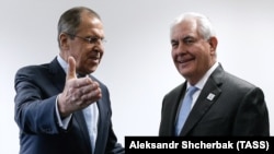 Russian Foreign Minister Sergei Lavrov (left) talks to U.S. Secretary of State Rex Tillerson on the sidelines of the G20 foreign ministers meeting in Bonn on February 16. 