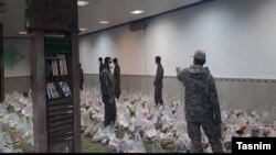 Basij militia prepare and distribute aid packages to families in need in Rasht. April 19, 2020.