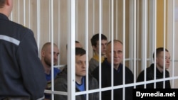 Election opponents of Belarusian President Alyaksandr Lukashenka sit in the dock in a Minsk courtroom on May 11.