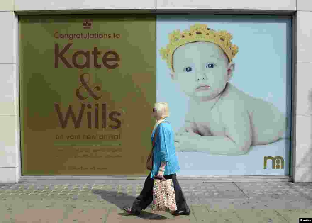 A Mothercare store displays a poster congratulating Britain&#39;s Prince William and his wife, Catherine, on the birth of their baby boy, on Oxford Street in central London.