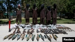 Insurgents suspected of being from the Haqqani network are presented to the media at the National Directorate of Security headquarters in Kabul in May. (file photo)