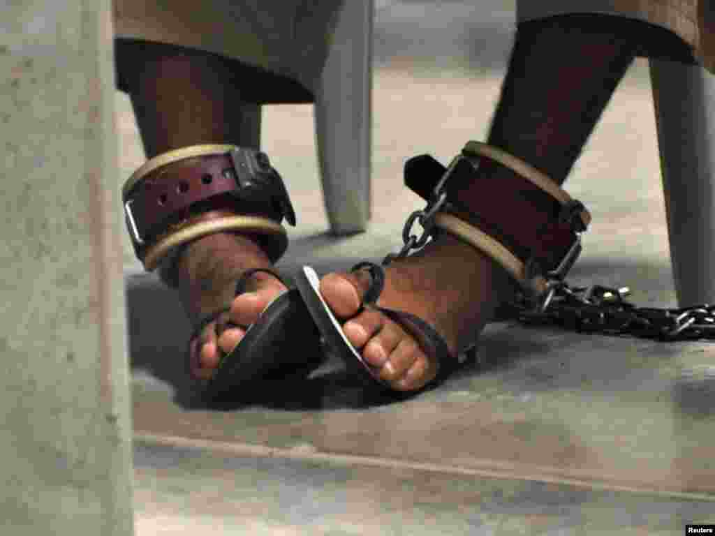 A detainee wears shackles as he attends a "life skills" class inside the Camp 6 high-security facility at Guantanamo Bay, Cuba. Photo by Michelle Shephard for Reuters