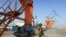 A Pakistani soldiers guarding port cranes in Gwadar, a seaport in Balochistan. 