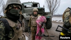 Ukrainian servicemen who fought in Debaltseve are seen near Artemivsk on February 19.