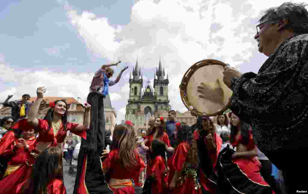 Participants in the Khamoro World Roma Festival dance through the historic center of Prague. (Reuters/David W. Cerny)