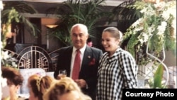 Soviet immigrant Eda Gorbis (right) poses with the Gorbachev lookalike.