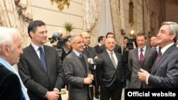 Armenia -- President Serzh Sarkisian (R) meets with prominent members of France's Armenian community in Paris, 10 March 2010.