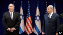 U.S. Secretary of State Mike Pompeo, left, and Israeli Prime Minister, Benjamin Netanyahu, stand during statements to the press during a meeting at the Prime Minister's residence in Jerusalem, Friday, Oct. 18, 2019. 