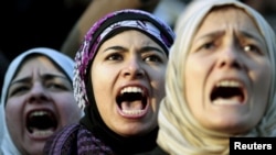 As parliament gets set to sit for its first session, demonstrations still take place against the Egyptian military council at Tahrir square in Cairo.