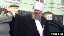 "Have you been to church today? Think about your soul, then you can ask me questions," Metropolitan Pavlo tells the flustered cops.
