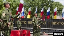 Servicemen with the military forces of South Ossetia attend an oath of allegiance ceremony in Tskhinvali, the capital of the breakaway Georgian region in July 2015. 