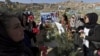 FILE: Afghan women rights activists protest on the grave of 27-year-old woman, Farkhunda, who lynched by a mob in Kabul in Kabul in March 2015.