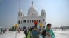 Sikh pilgrims at the Gurdwara Darbar Sahib in Kartarpur on September 22. The Pakistani site is so close to the border that its white dome and four cupolas can be seen from India.
