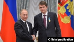 Иван Таврин, медиаменеджер, с Владимиром Путиным на вручении наград в Кремле. Москва, 21 мая 2015 года.