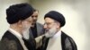 Iranian Supreme Leader Ayatollah Khamenei (L) talks to Ebrahim Raeesi, the head of the judiciary in Tehran, March 7, 2019. File photo