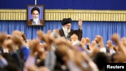 Iran's Supreme Leader Ayatollah Ali Khamenei waves as he arrives to address a crowd in Tehran, April 27, 2016