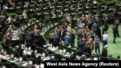 Iranian lawmakers attend a session of parliament in Tehran, July 16, 2019. This is a file photo, as none were available from the closed-door session.