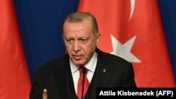 Turkish President Recep Tayyip Erdogan speaks during a joint press conference with Hungarian Prime Minister at Varkert Bazar cultural center in Budapest, November 7, 2019