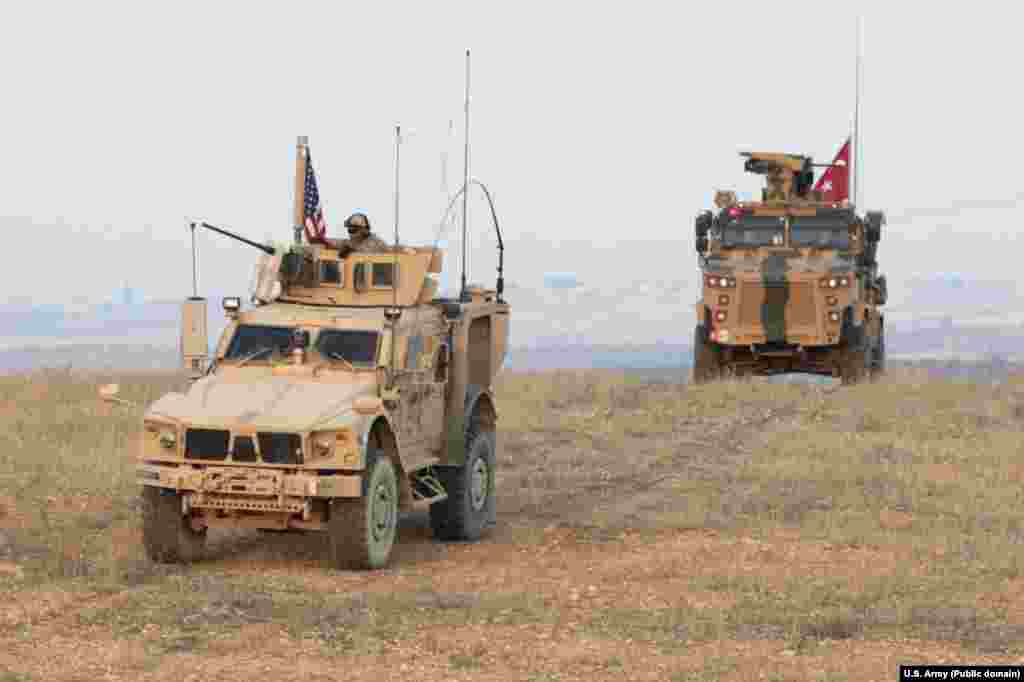 U.S. and Turkish forces conduct joint patrols on the outskirts of Manbij in November 2018. Syria is today an &quot;ever congested&quot; battle space, with U.S.-, Turkish-, Syrian-, Russian-, and Iranian-affiliated fighters all variously cooperating and clashing in the country.&nbsp;